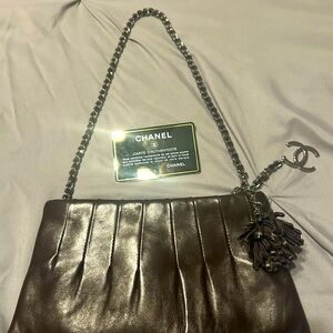Authentic Chanel small espresso evening leather bag.